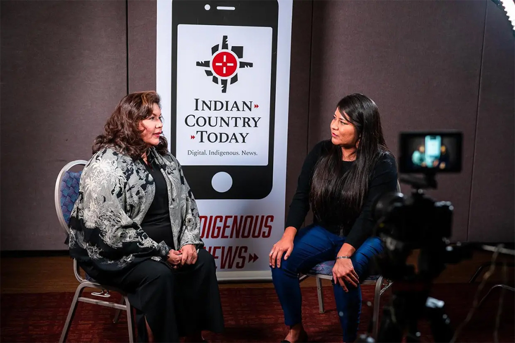 two women talking at an interview