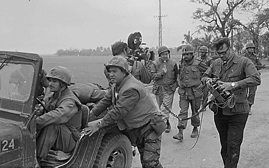 Walter Cronkite and a CBS crew interviewing the commanding officer of the 1st Battalion, 1st Marines, during the Battle of Hue City, Feb. 2, 1968, in Vietnam. National Archives
