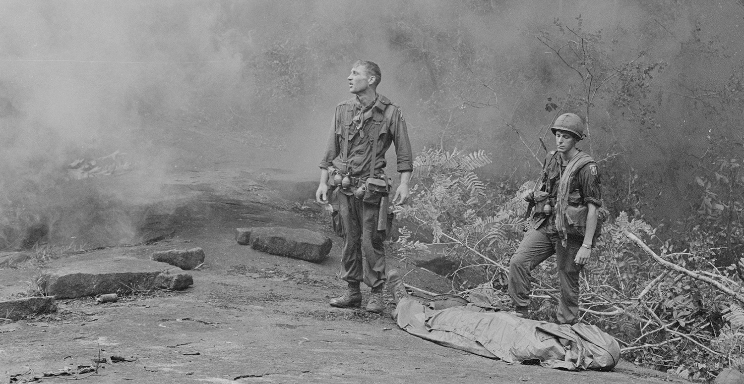 Long Khanh Province, Republic of Vietnam. SP4 R. Richter, 4th Battalion, 503rd Infantry, 173rd Airborne Brigade (left) and Sergeant Daniel E. Spencer (right), staring down at their fallen comrade. National Archives