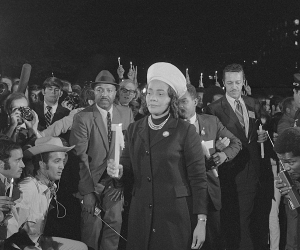 Coretta Scott King holding a candle and leading a march at night to the White House as part of the Moratorium to End the War in Vietnam, which took place on October 15, 1969. Library of Congress